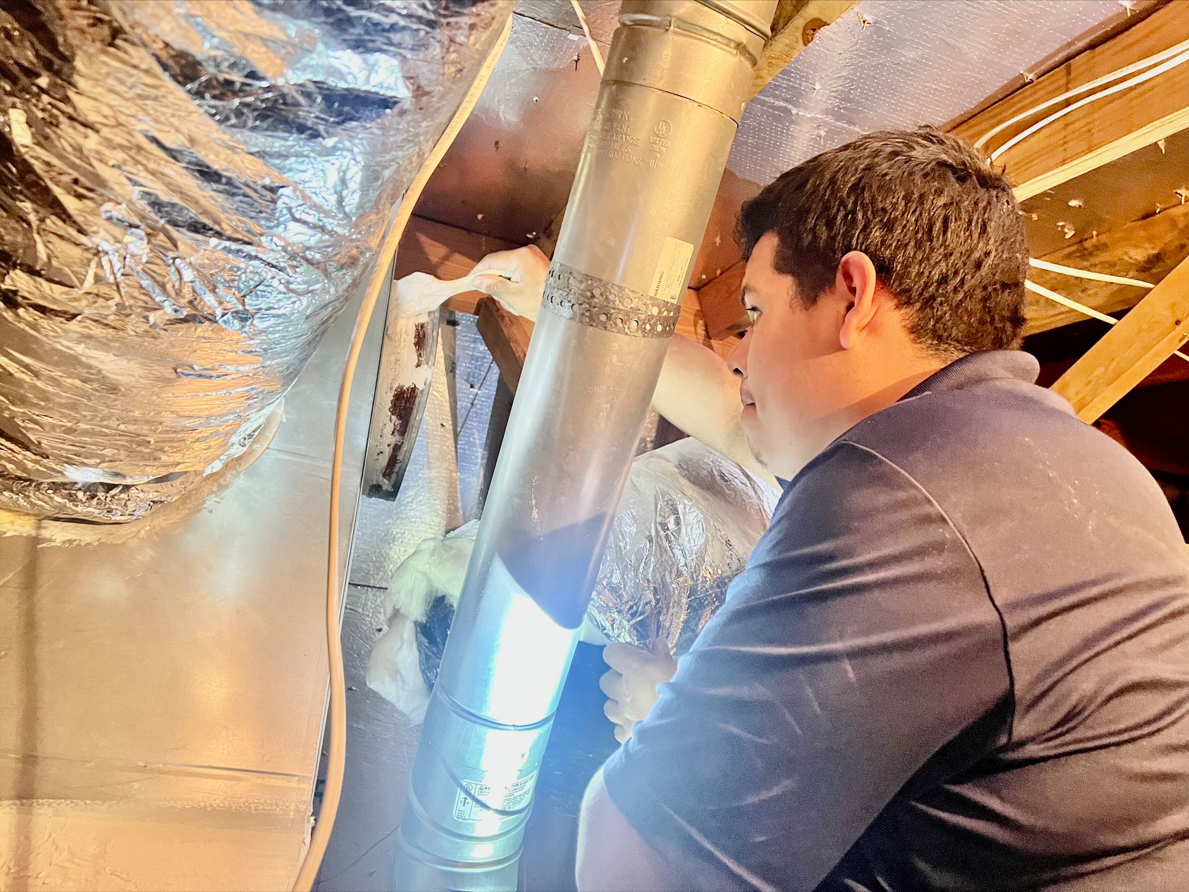 technician working on ducts